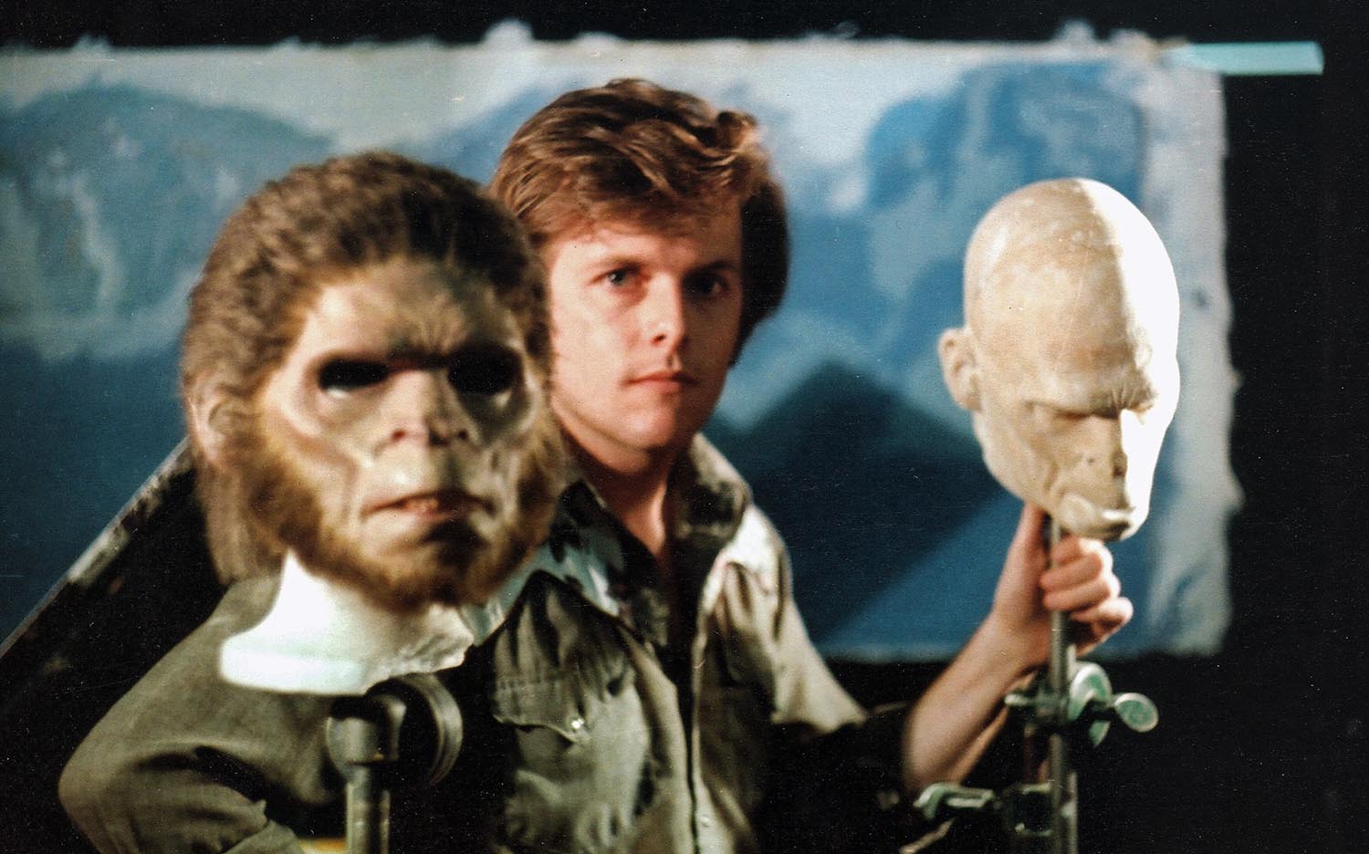 Randy Cook and the hominid masks used in the film.